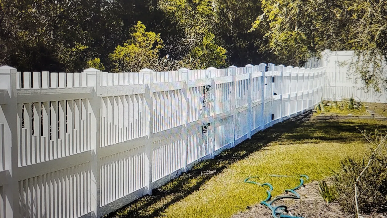 White vinyl picket fence installed by RB Fence in Cumberland County