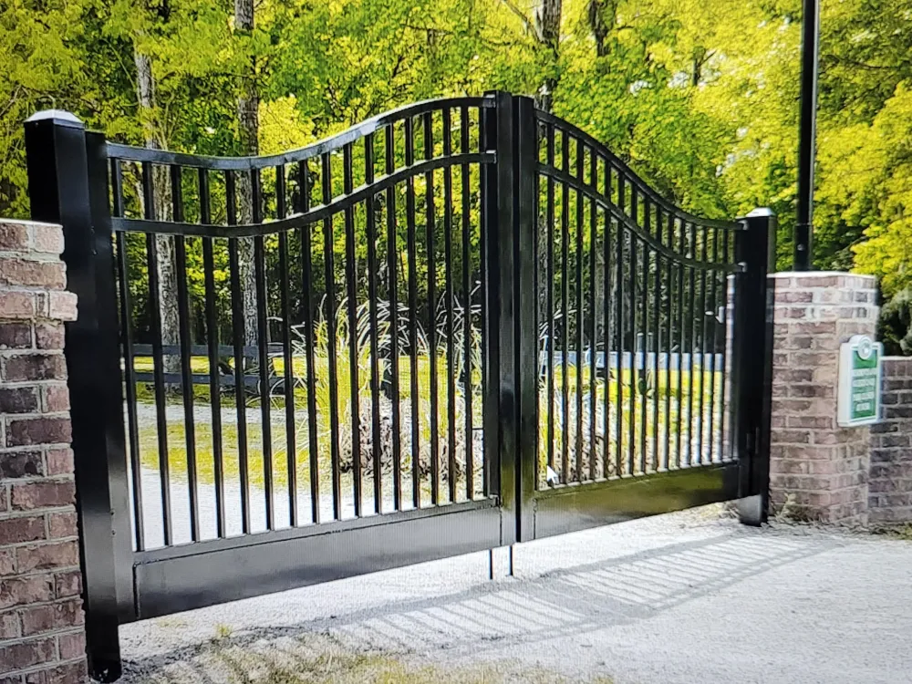 Large custom double entrance gate on brick columns built by RB Fence